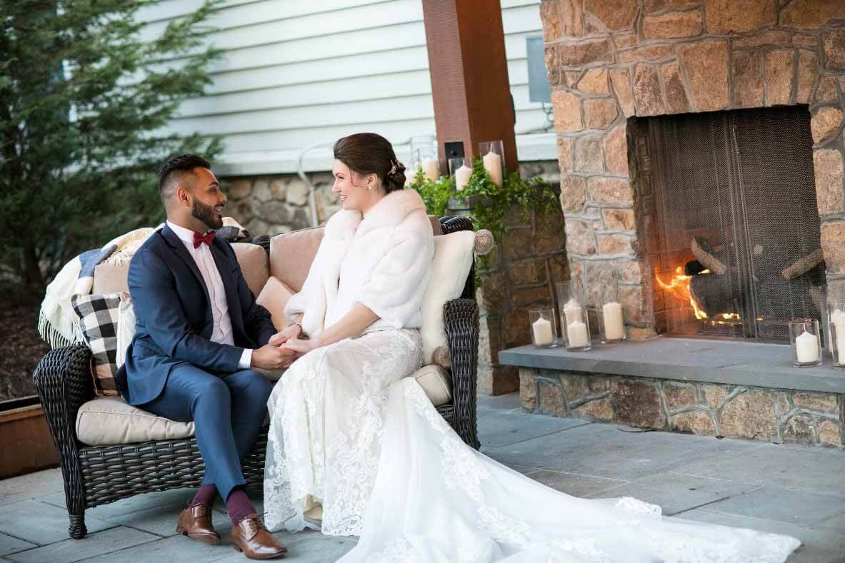 Bride and Groom Courtyard in front of fireplace